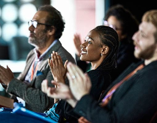 Business people applauding at business conference