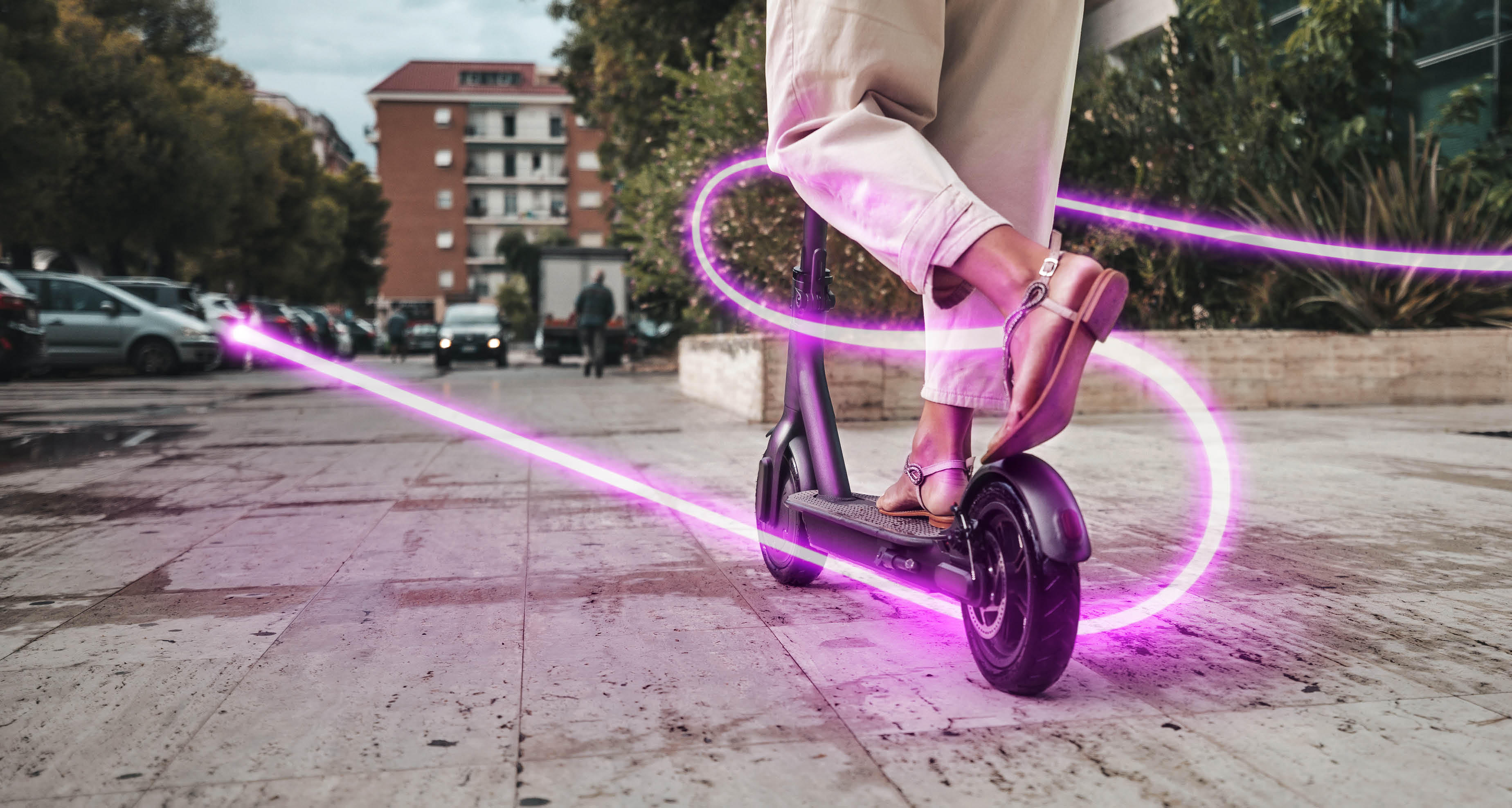 Woman riding an electric scooter to commute to works place  Green incentive promoting the usage of electric scooters   Note for inspectors: please read notes