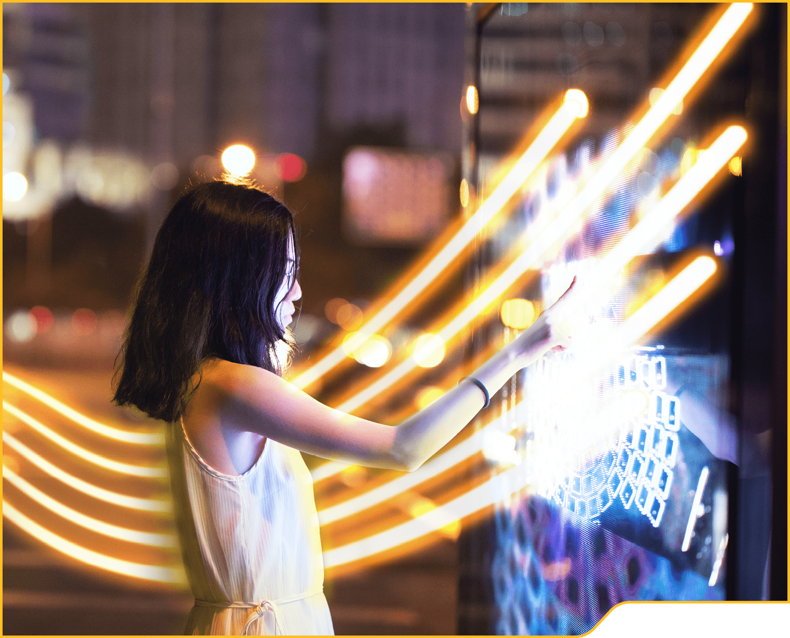 Young female using touch screen on the street