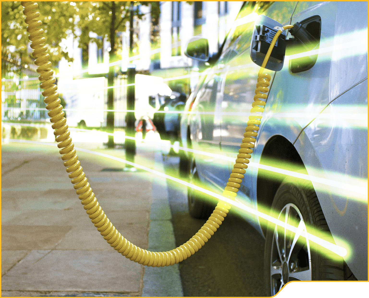 An Eco Electric car is re-charged from city street power point.