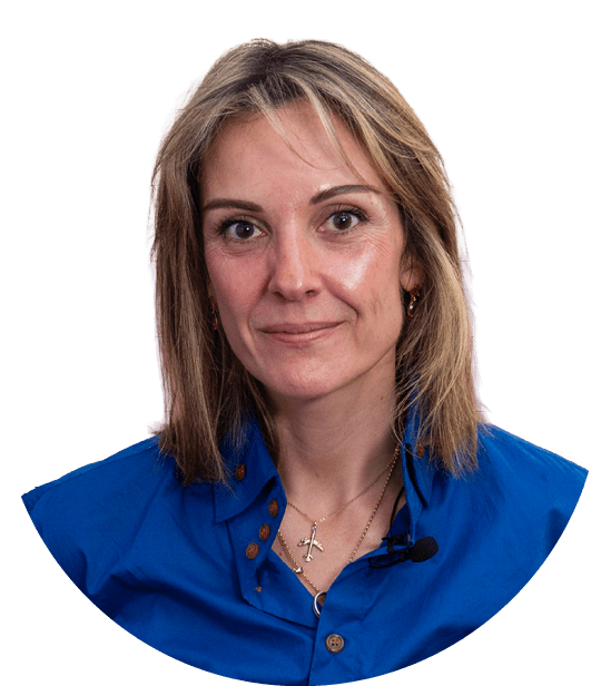 A woman wearing a blue shirt and a red belt. Description generated by AI