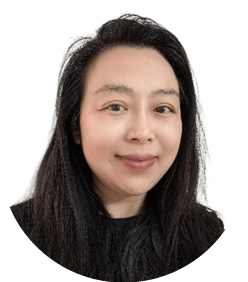 A woman with long black hair and a black shirt. Description generated by AI