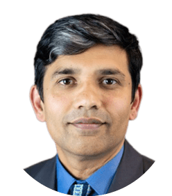 A man wearing a blue tie. Description generated by AI