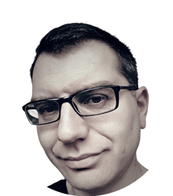 A man wearing glasses. Description generated by AI