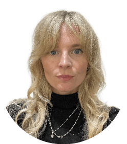 A woman wearing a black shirt and a necklace. Description generated by AI