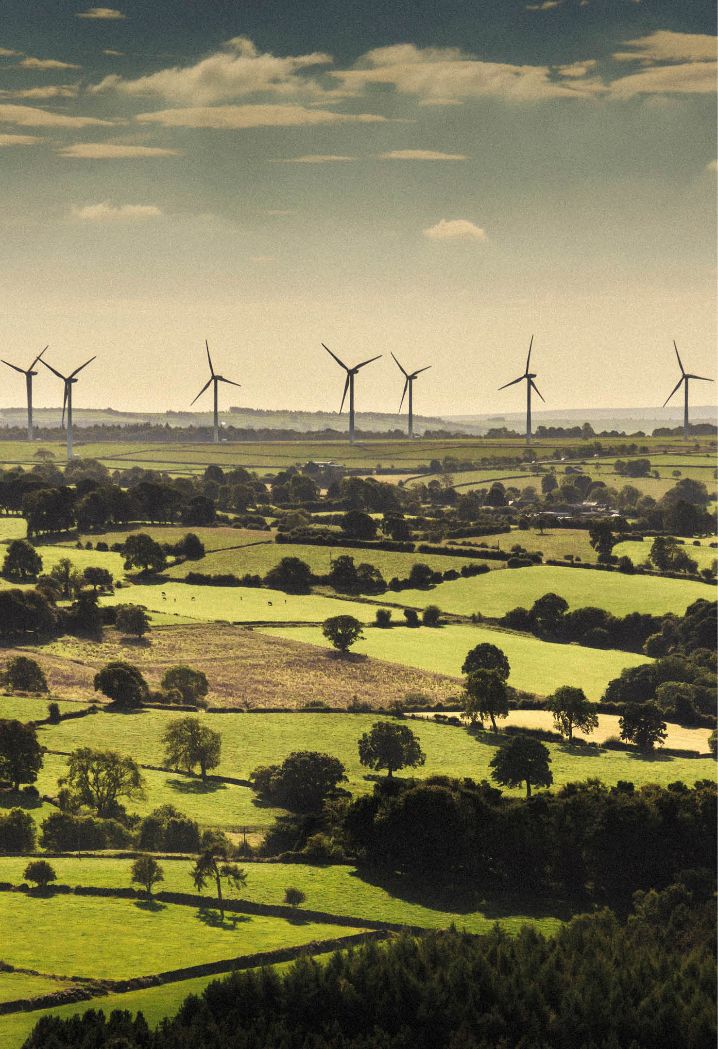 Wind turbines and farmland near Leeds, West Yorkshire. Aerial view from a helicopter 